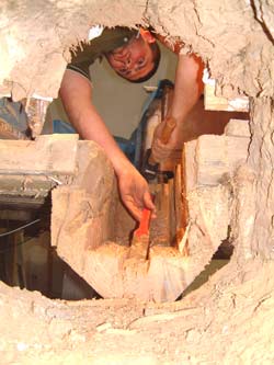 Dug out centre of a large beam damaged by Death watch Beetle